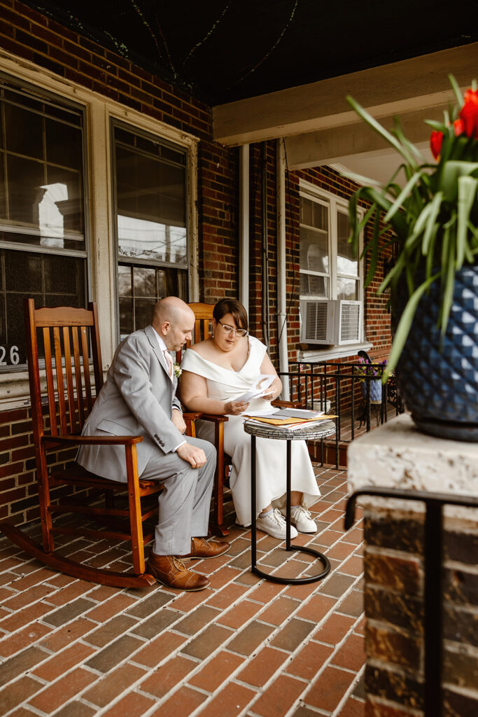 elopement couple reading letters together written by their loved ones