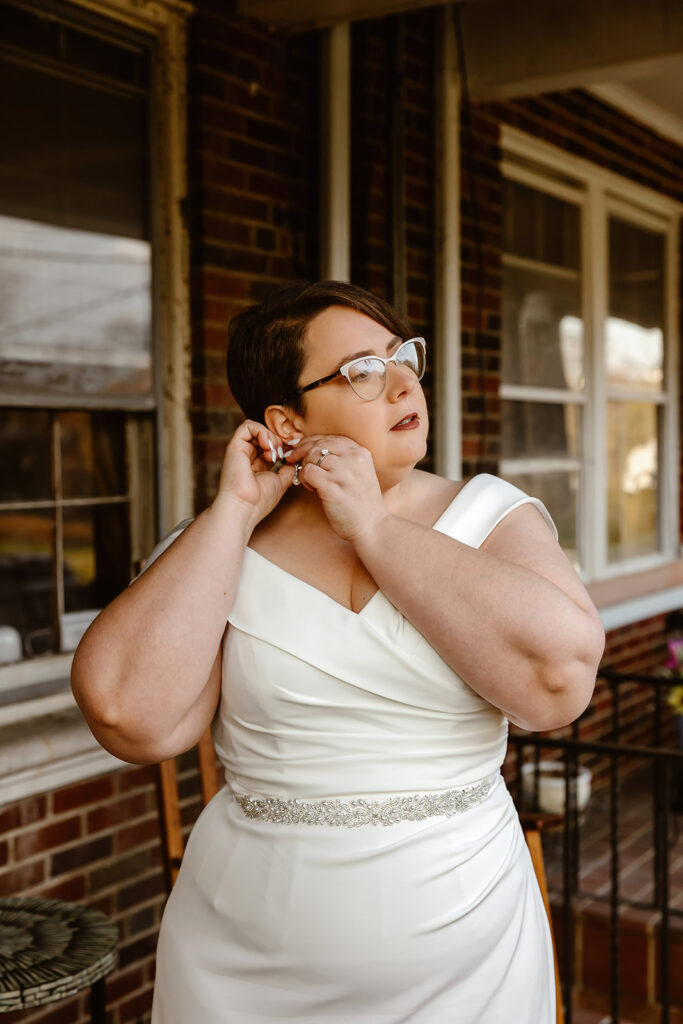 bridal portrait outside the couple's red brick home