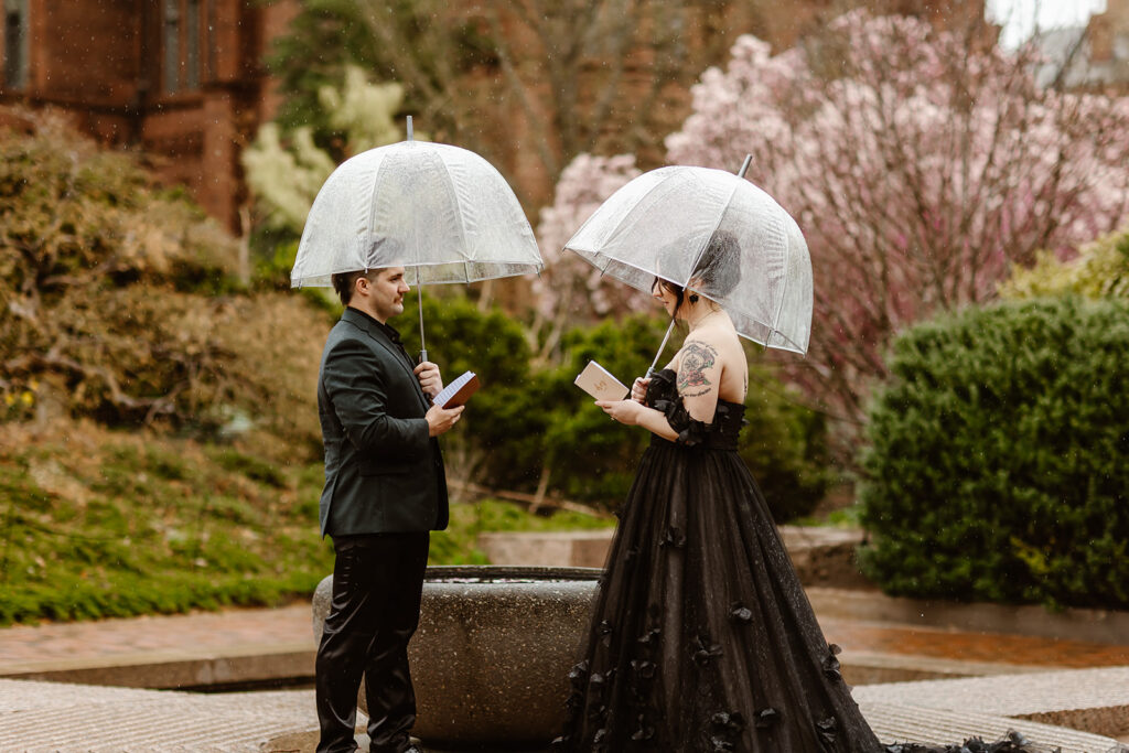 romantic rainy elopement ceremony in washington dc, the couple is standing under clear umbrellas