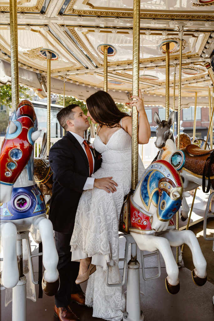 elopement couple riding a carousel during their full day elopement at washington dc