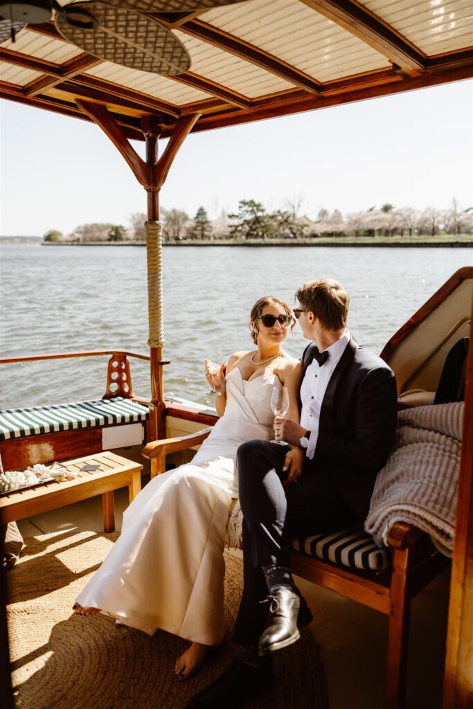 elegant elopement couple taking a boat ride during their full day elopement in washington dc