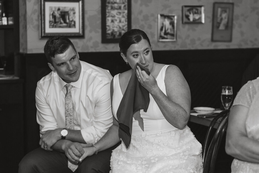 candid couple moment during their small elopement reception with family