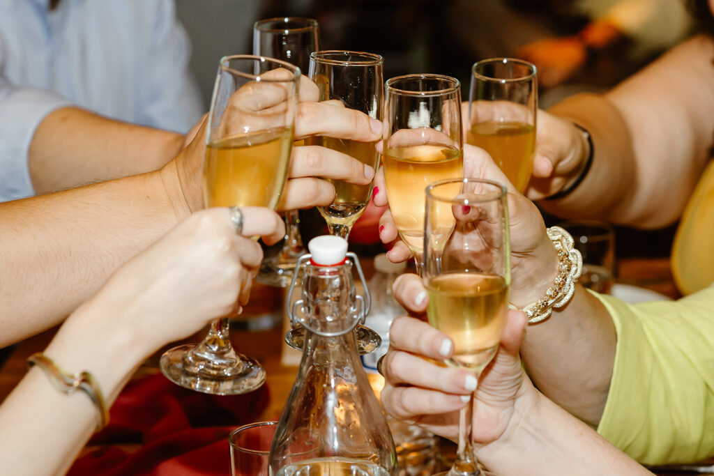 elopement couple toasting champagne with their closest loved ones