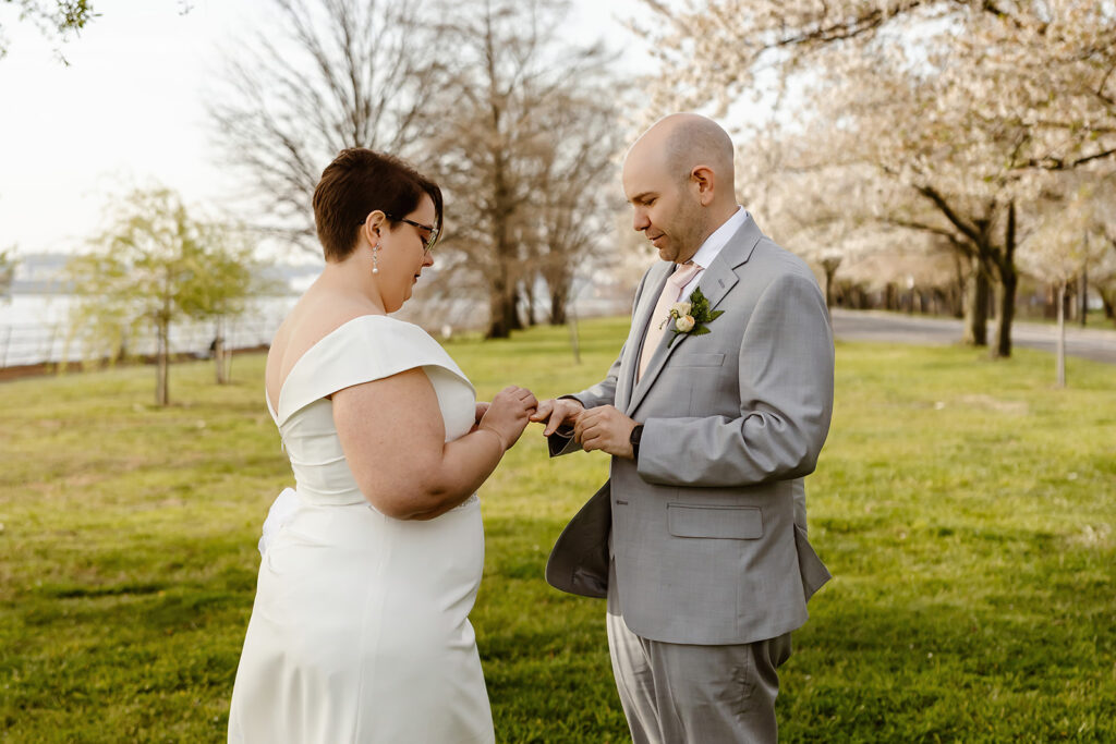 park elopement ceremony with cherry blossoms in the backdrop