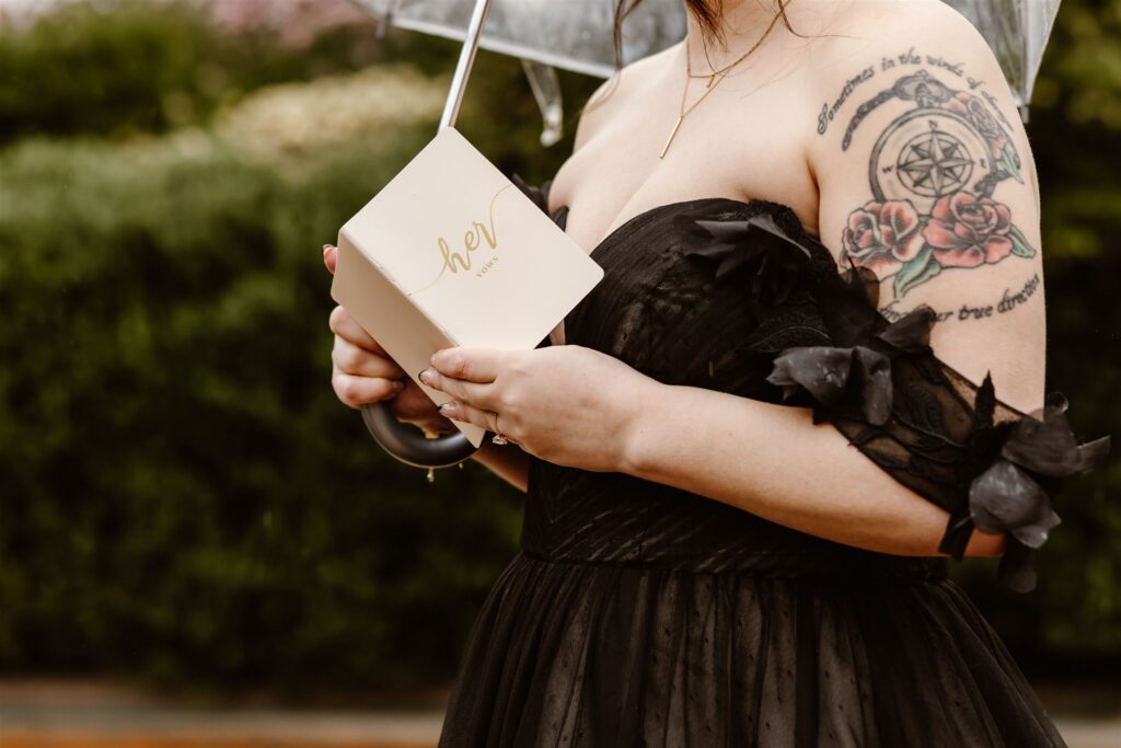 close up of bride holding vow book