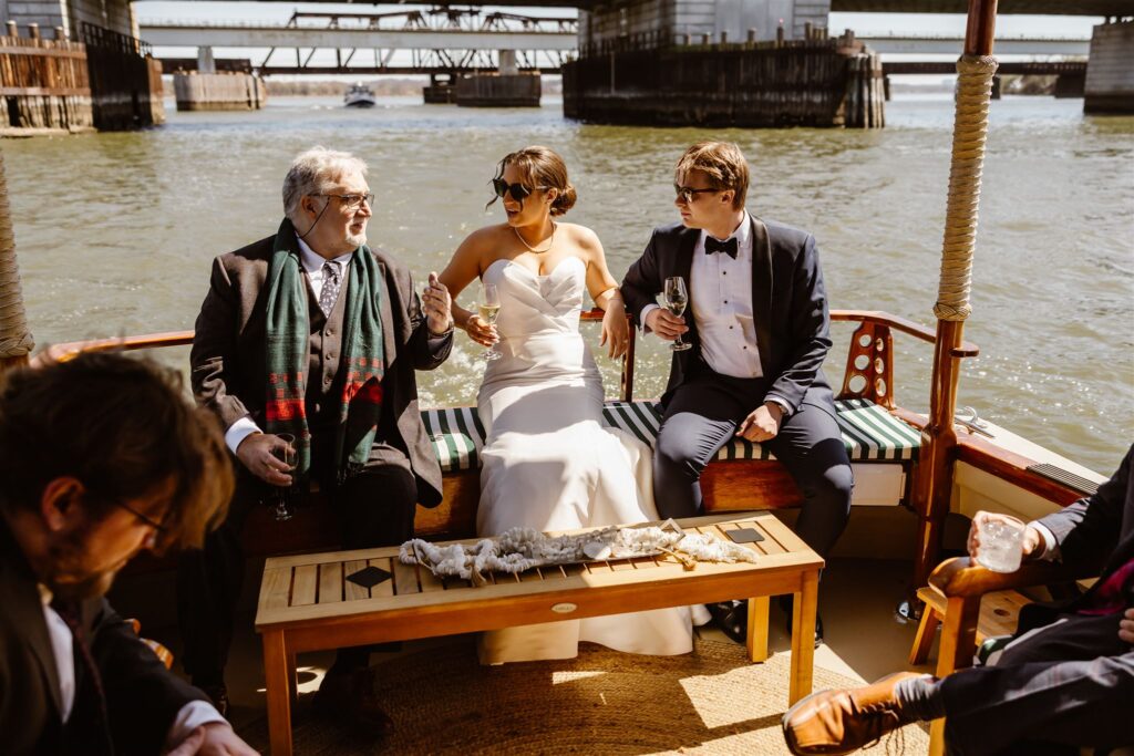 bride and groom enjoying a boat ride in dc