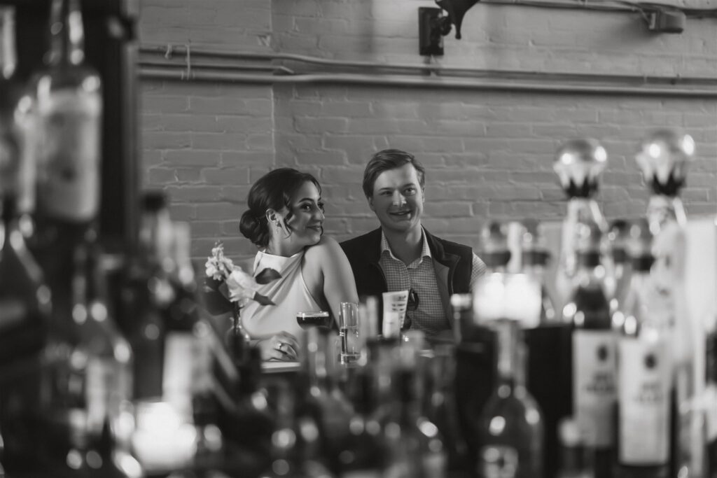 elopement couple enjoying cocktails at a bar
