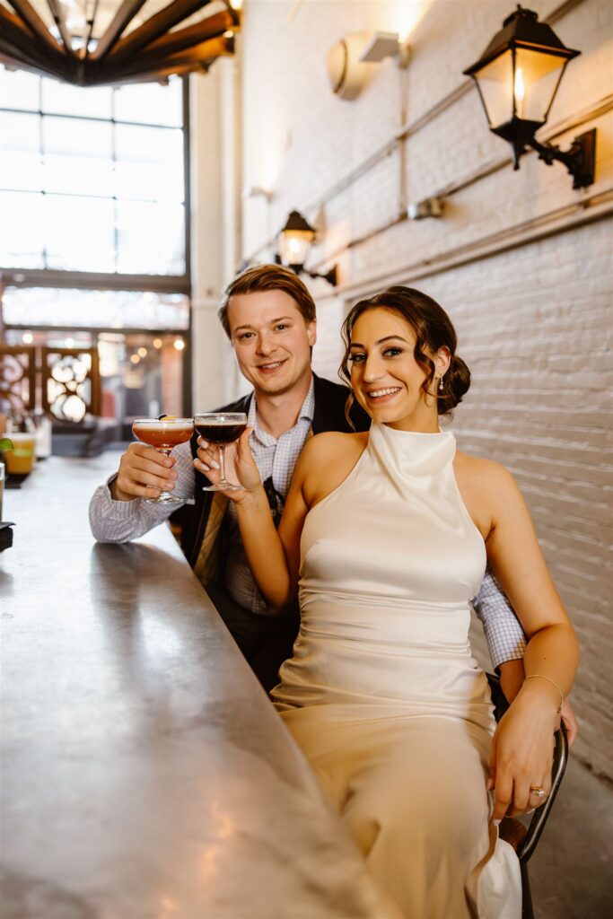 elopement couple enjoying cocktails at a bar