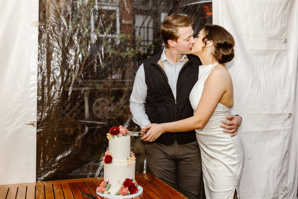 bride and groom cutting cake