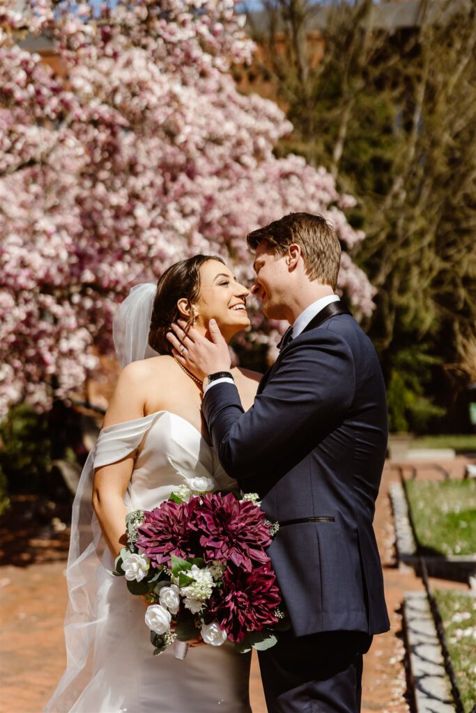 bride and groom kissing at the smithsonian castle gardens