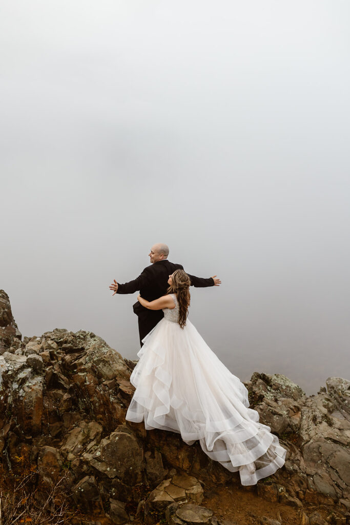 reverse titanic scene with bride holding the groom