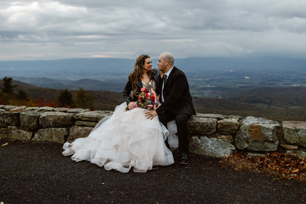 bride and groom during blue hour at a foggy overlook in shenandoah national park