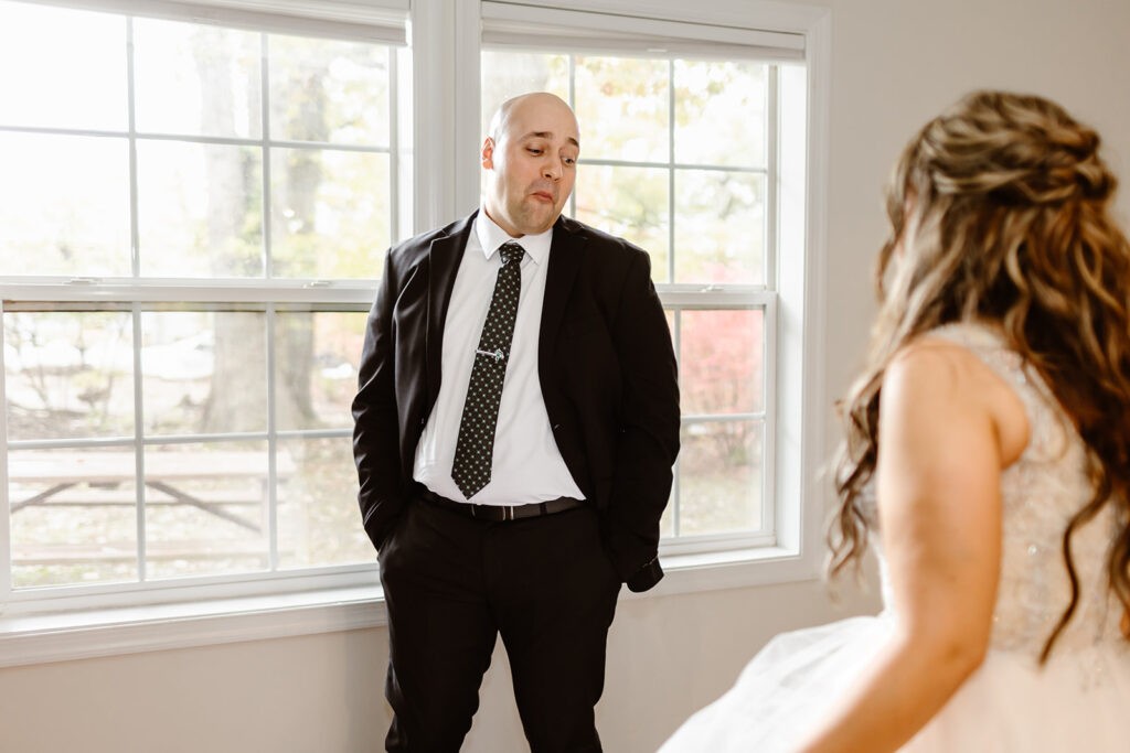 emotional bride and groom first look at the airbnb