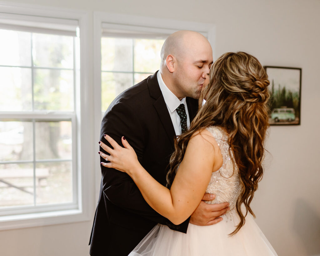 emotional bride and groom first look at the airbnb