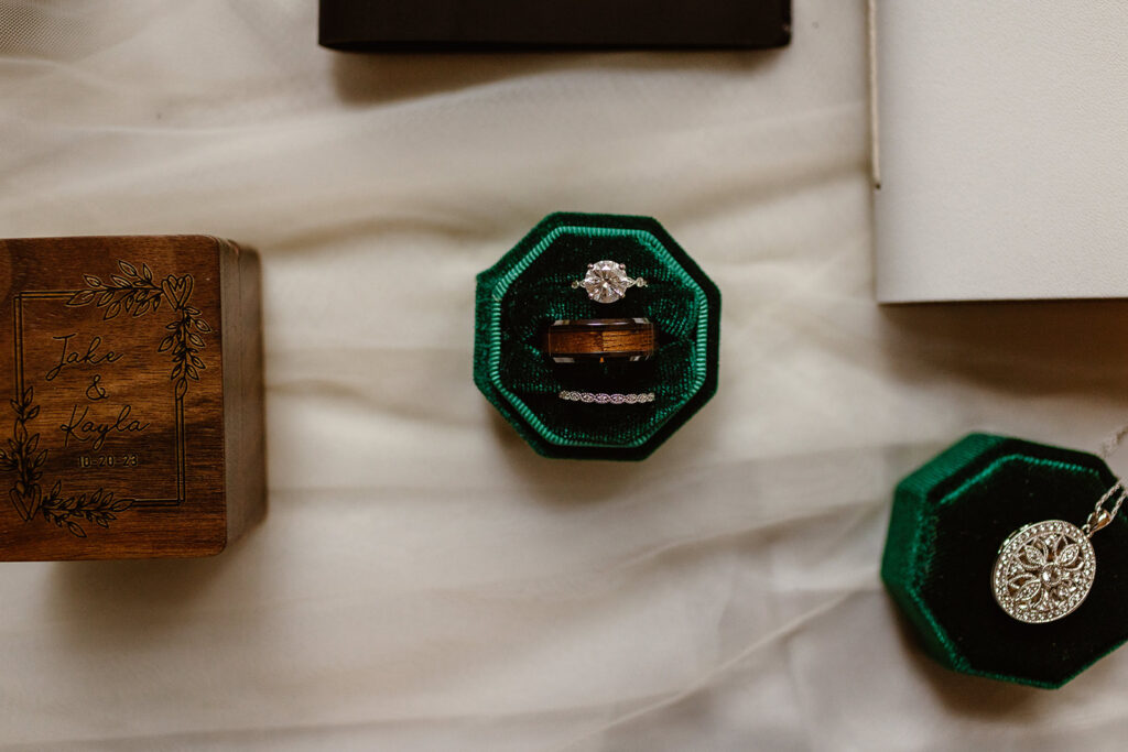 wedding ring set in an emerald green box