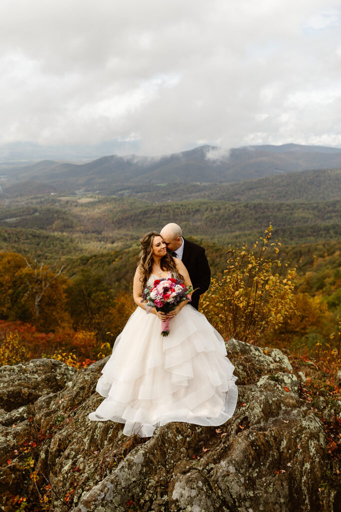 bride and groom posing on foggy overlook at Stony Man summit in Shenandoah during their Shenandoah National Park elopement in October