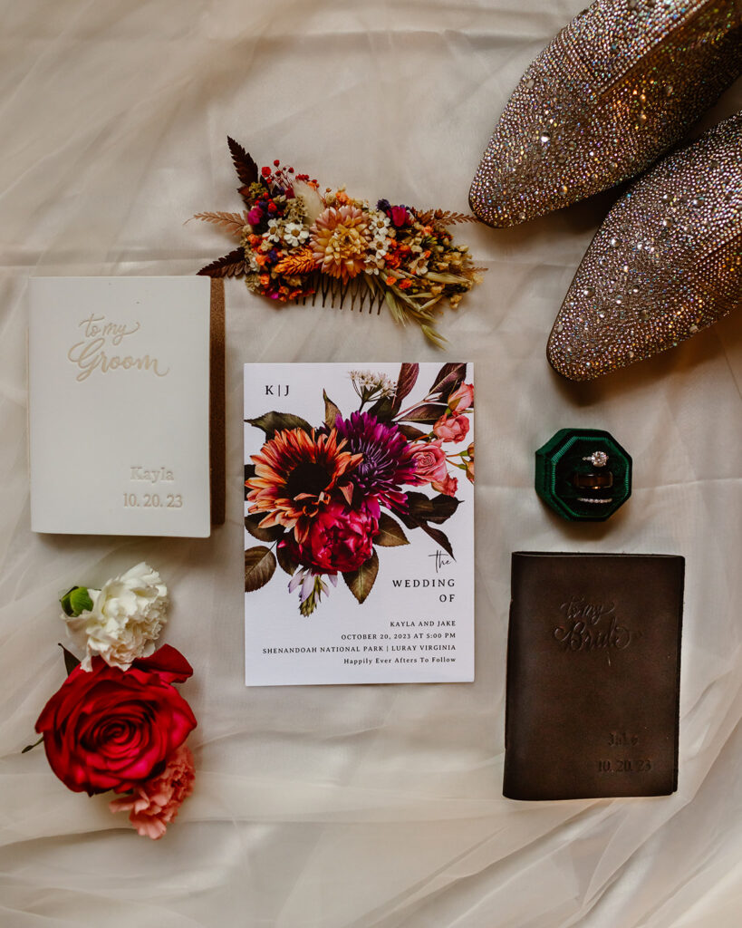 Flat lay of vintage compass, vow books, and mountain map for Shenandoah elopement