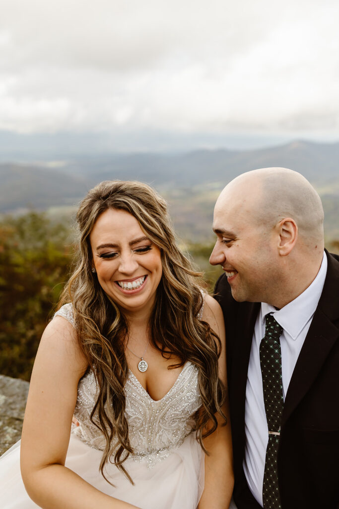 playful bride and groom at shenandoah national park in october