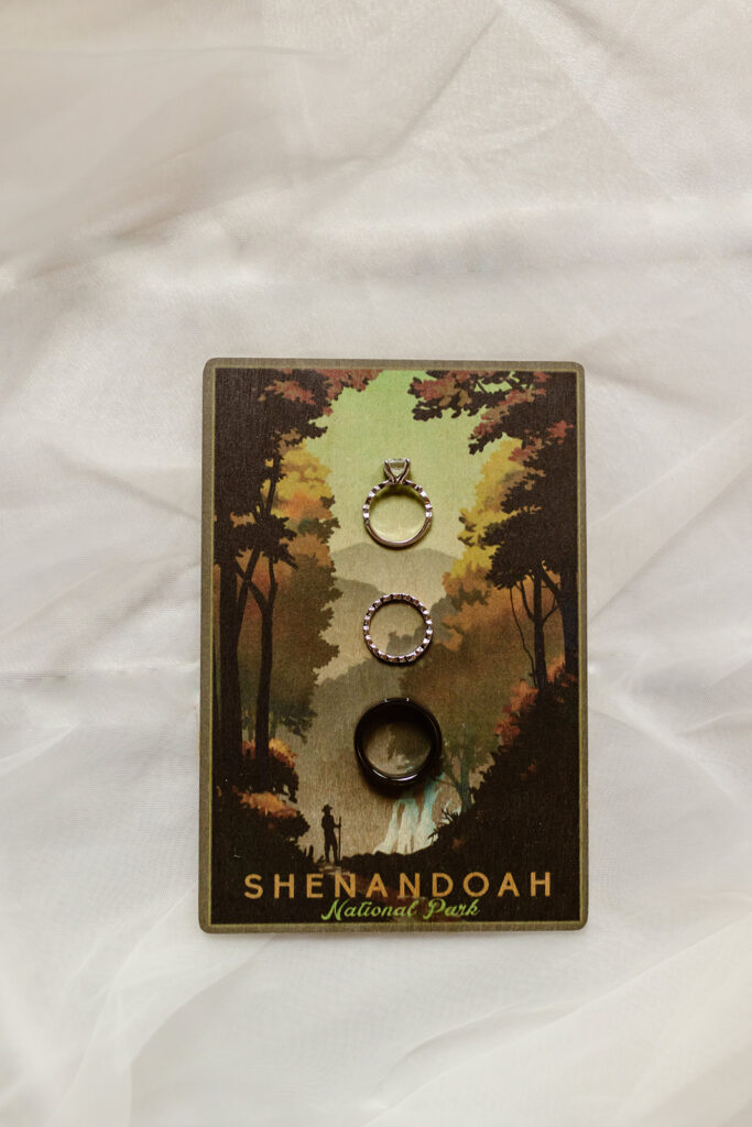Flat lay of vintage compass, vow books, and mountain map for Shenandoah elopement