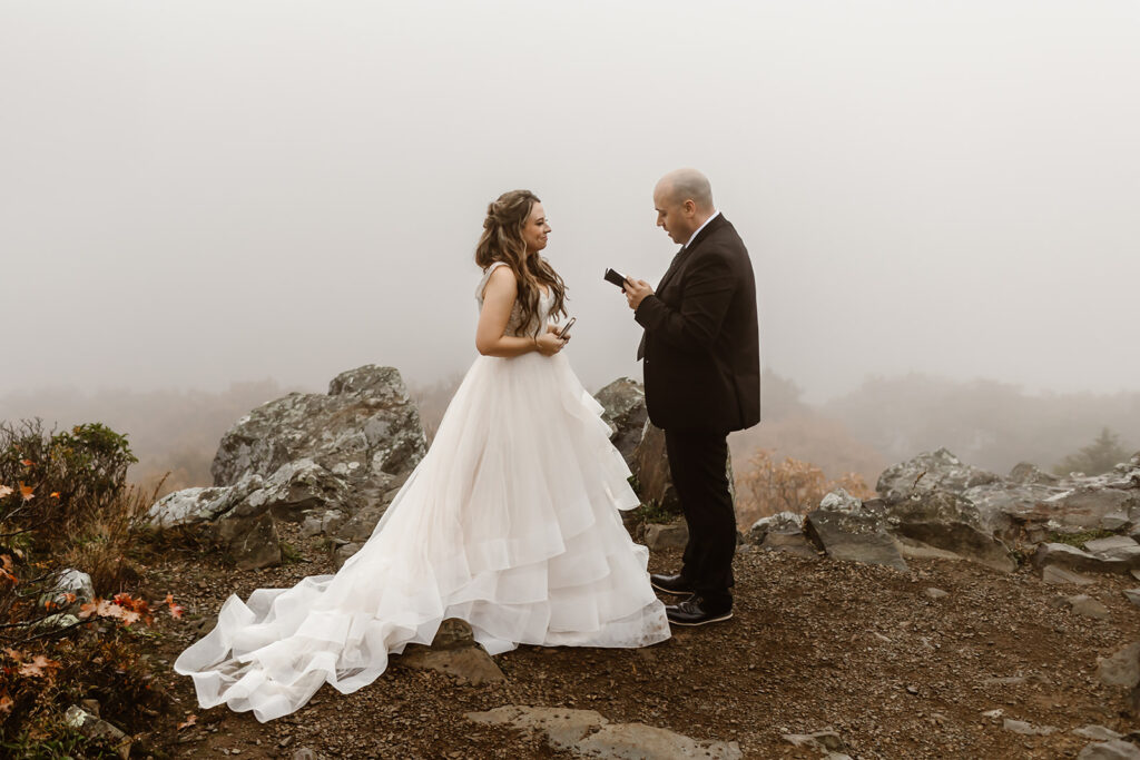 bride and groom exchanging private vows on a foggy overlook in shenandoah