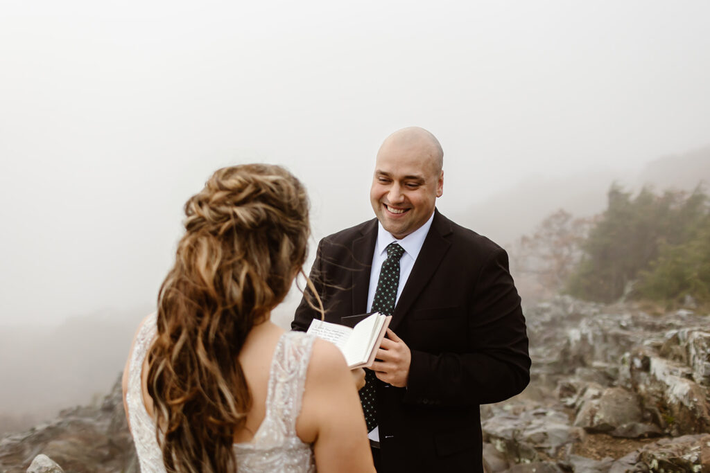 bride and groom exchanging private vows on a foggy overlook in shenandoah