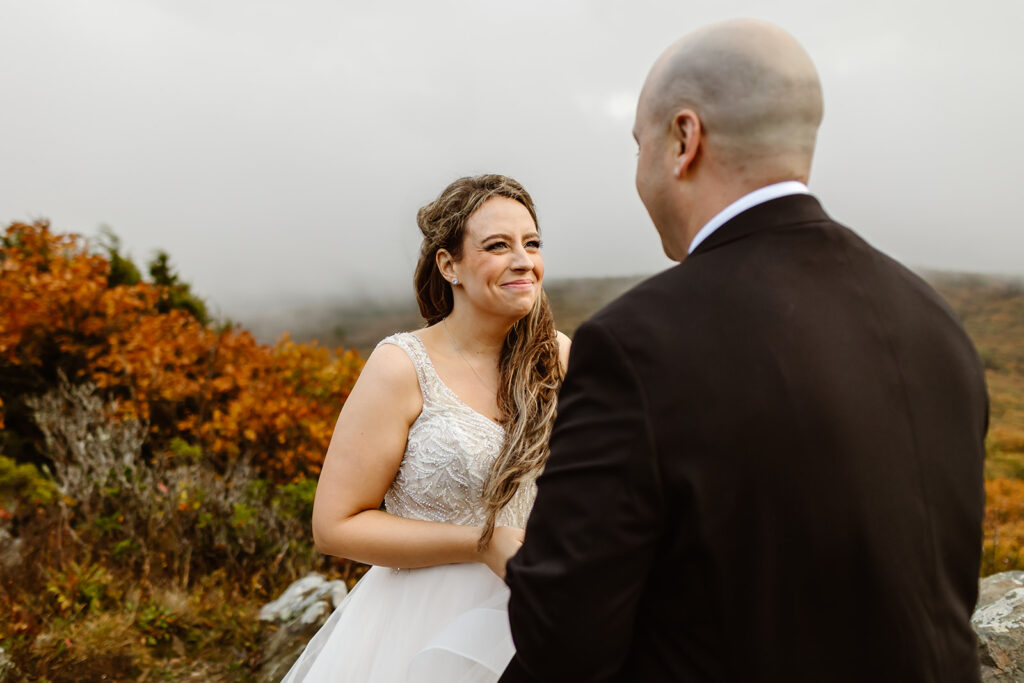 bride and groom exchanging private vows on a foggy overlook in shenandoah