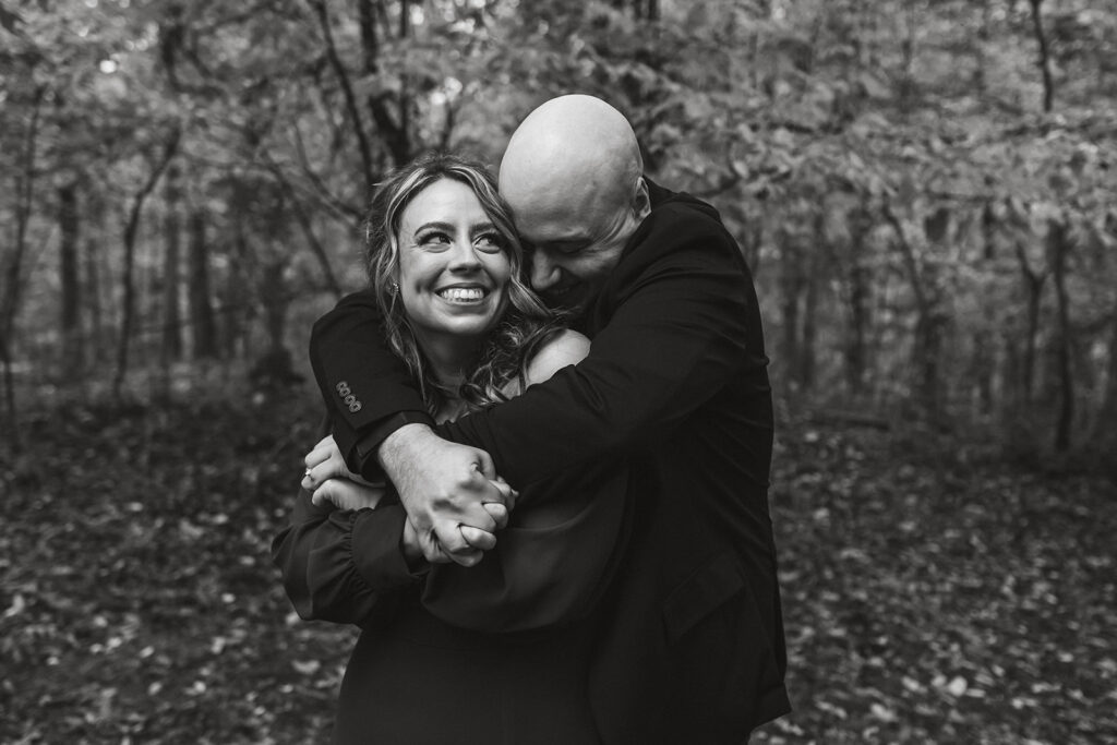 sweet couple with fall foliage in the backdrop during their session in Shenandoah National Park in October