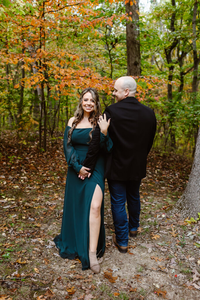 sweet couple with fall foliage in the backdrop during their session in Shenandoah National Park in October