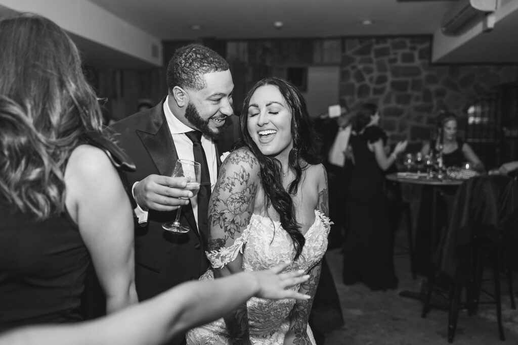bride and groom having fun on the dance floor during their winery micro wedding