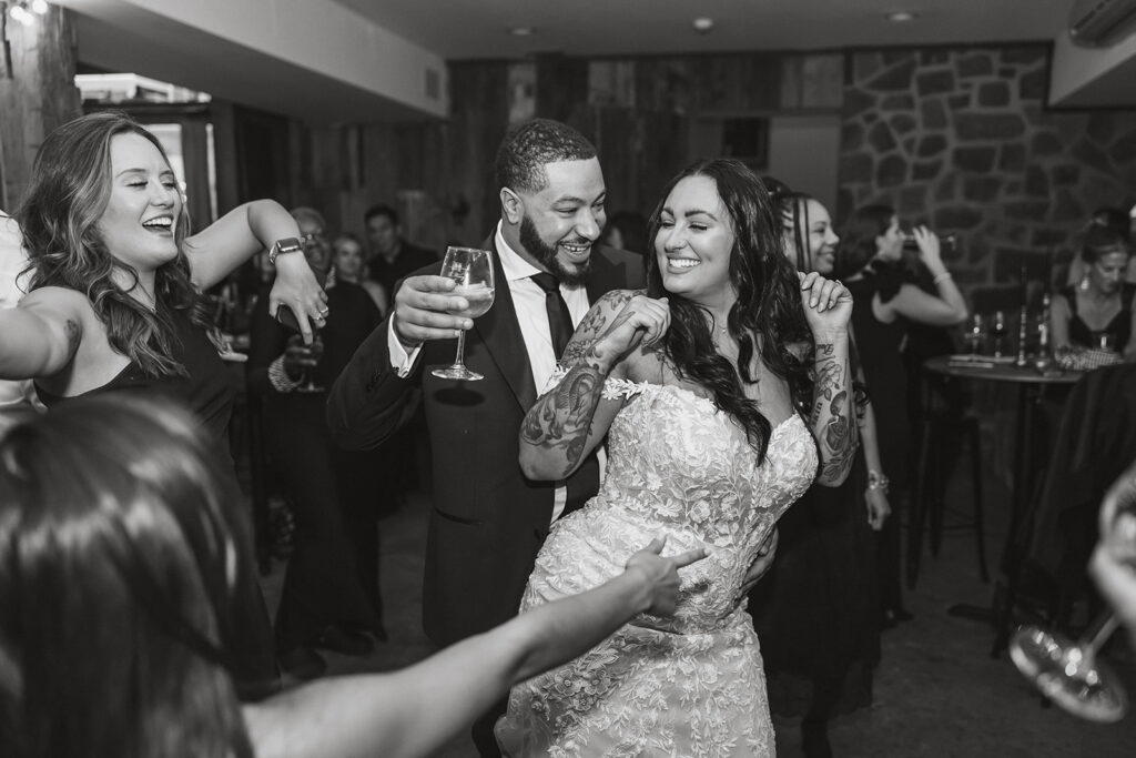 bride and groom having fun on the dance floor during their winery micro wedding