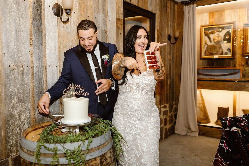 bride and groom cutting wedding cake