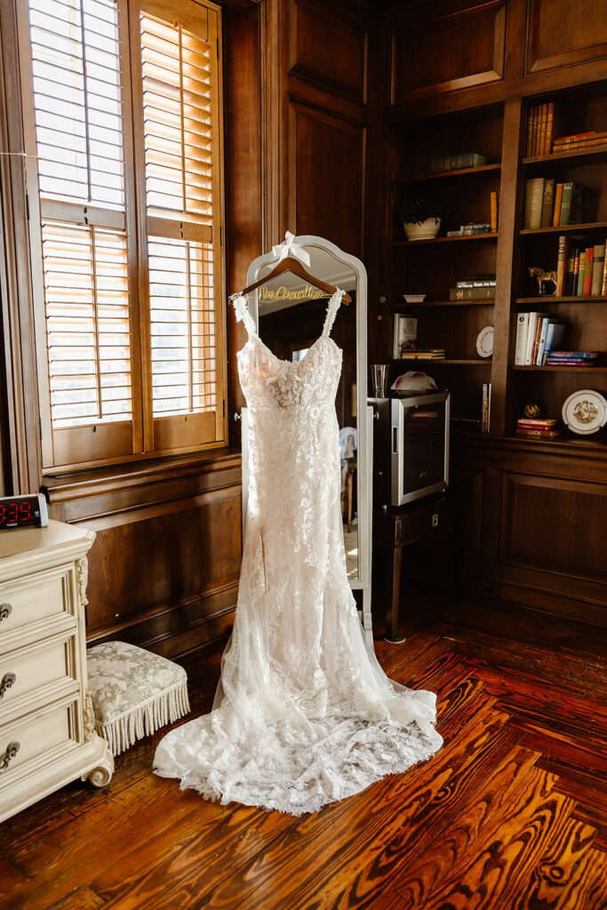 wedding dress hanging on the mirror