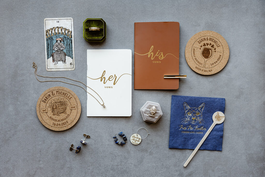 custom elopement detail flatlay of invite suite, cuff links and other details