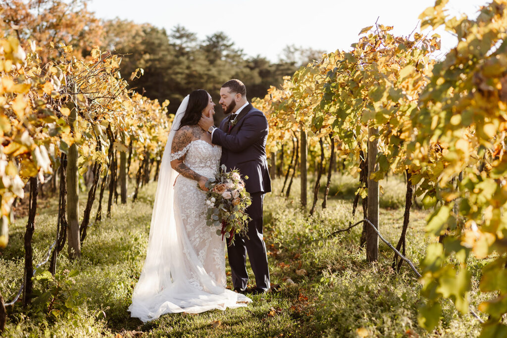 bride and groom surrounded by the vineyard at the winery at bull run
