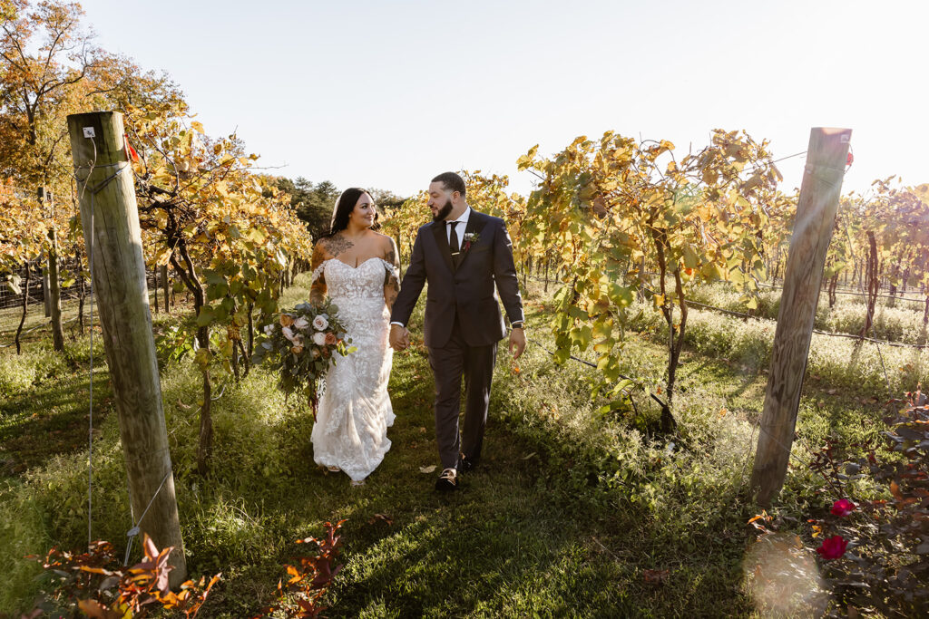 bride and groom surrounded by the vineyard at the winery at bull run