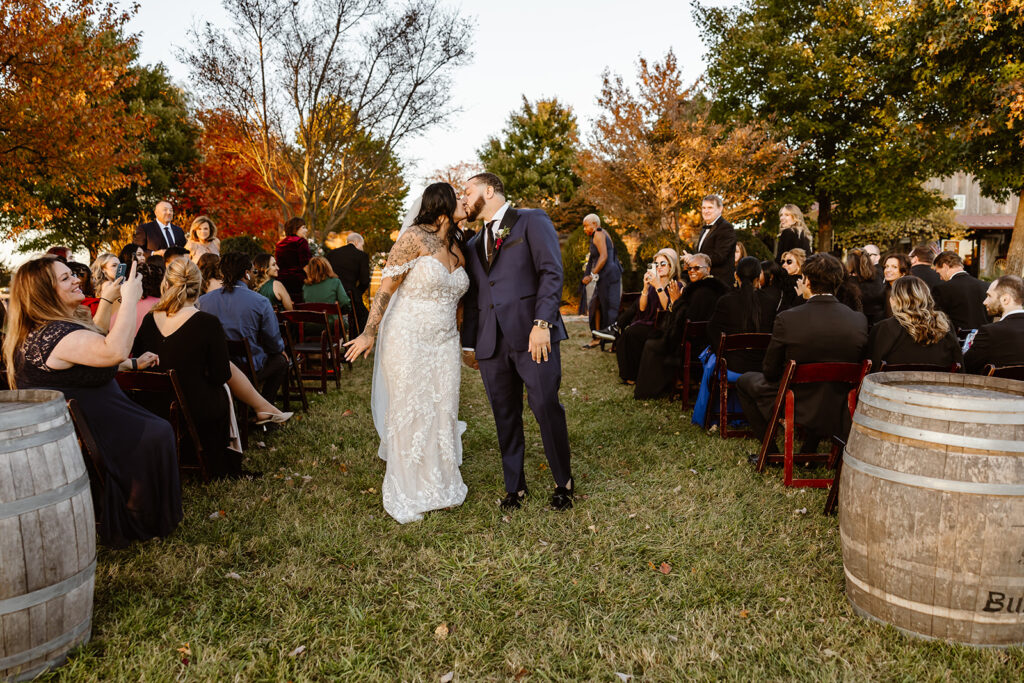 excited bride and groom exit from their wedding ceremony
