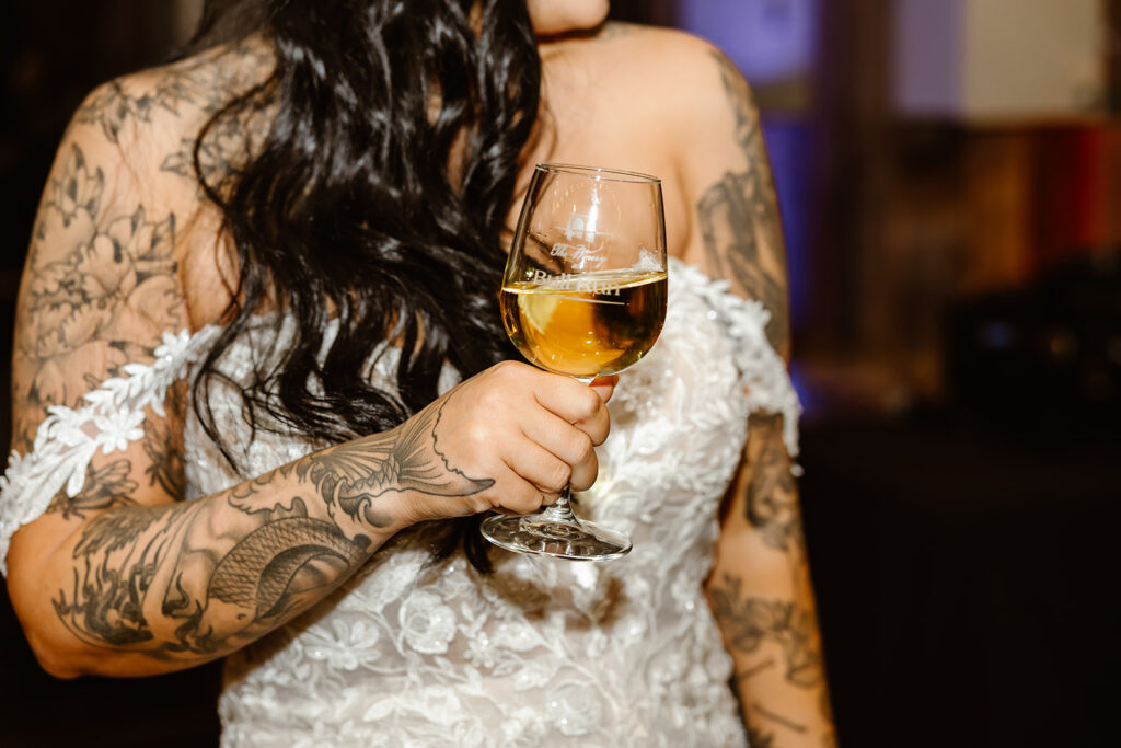 bride holding a glass of wine