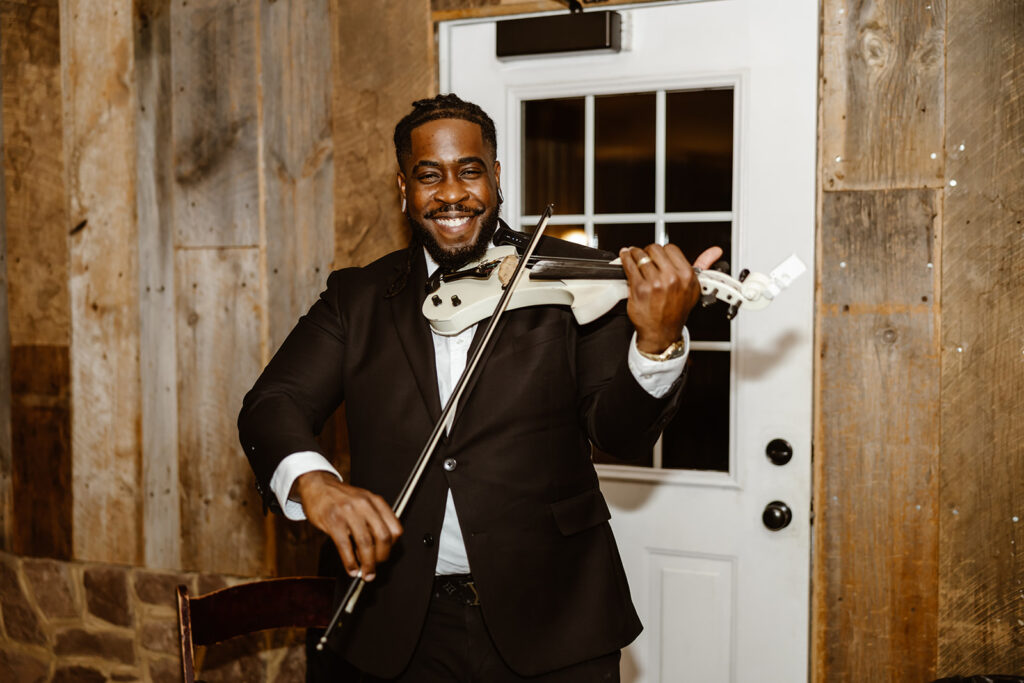 violinist playing during the wedding reception