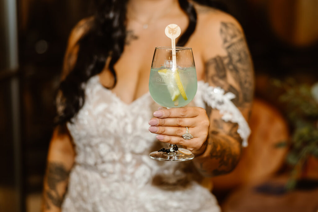 bride holding a cocktail