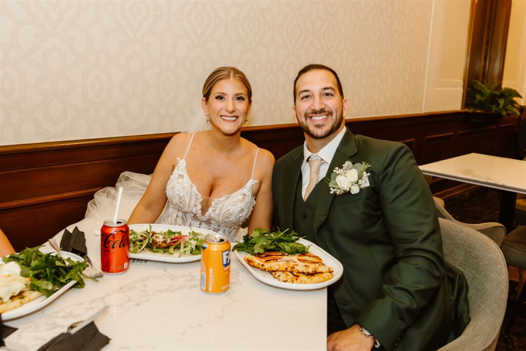 bride and groom enjoying lunch together