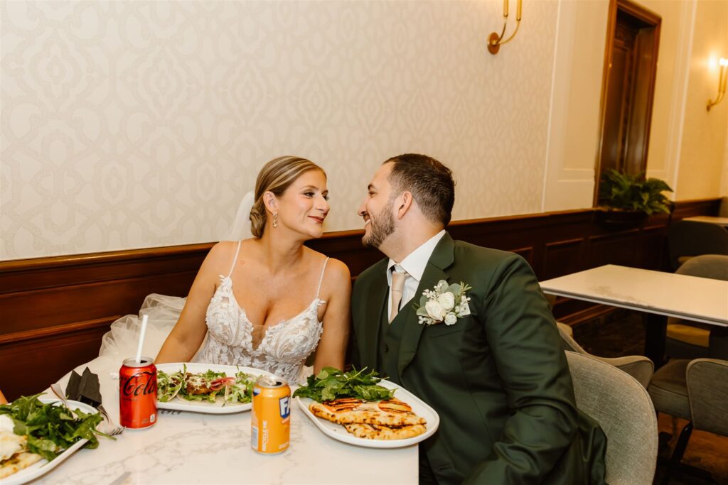 bride and groom enjoying lunch together
