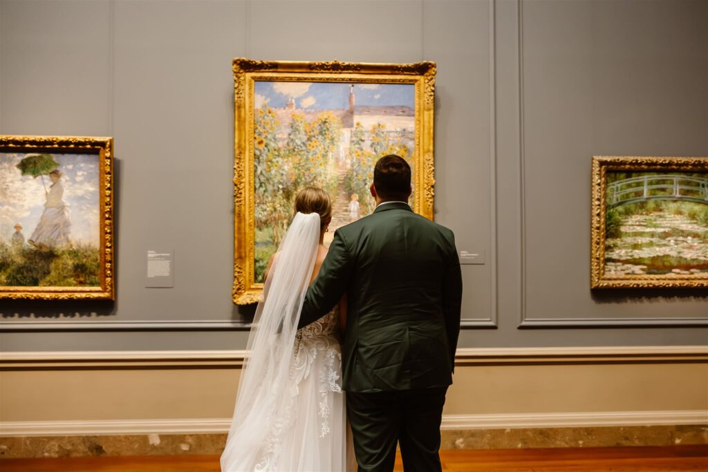 romantic elopement couple looking at the art inside the national gallery of art