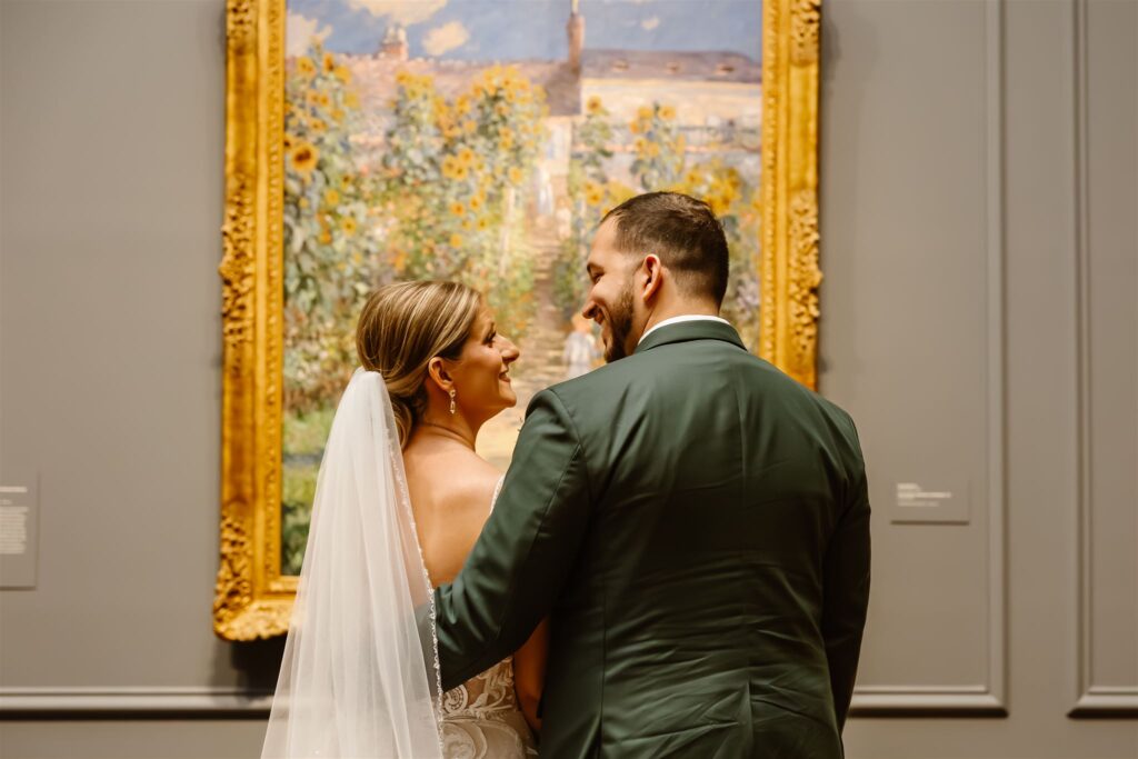 romantic elopement couple looking at the art inside the national gallery of art