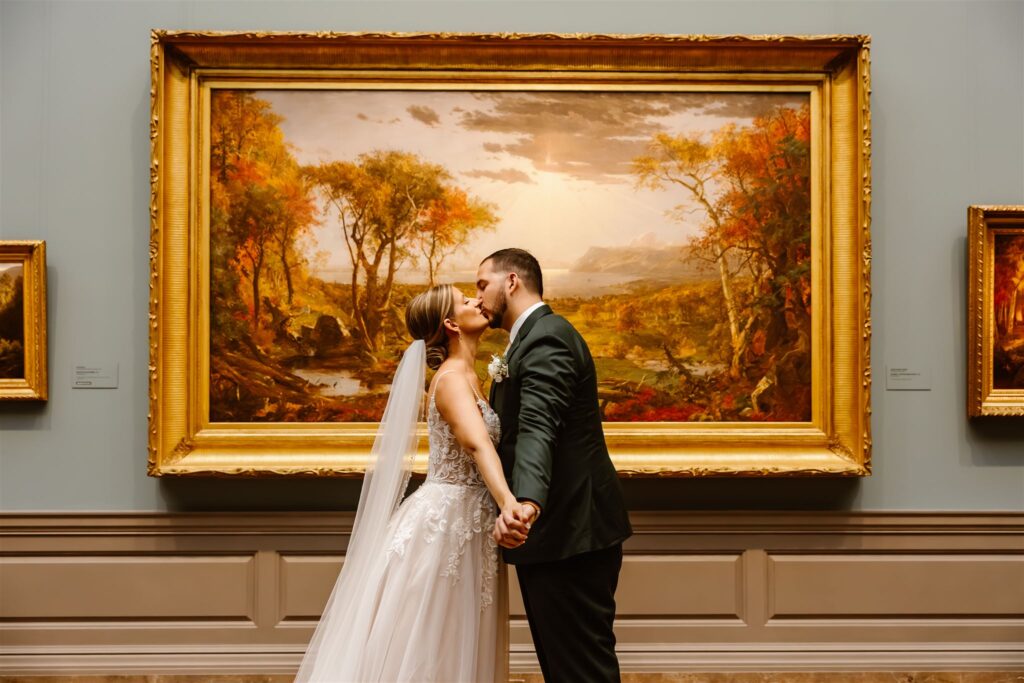 romantic elopement couple kissing in front of the art inside the national gallery of art