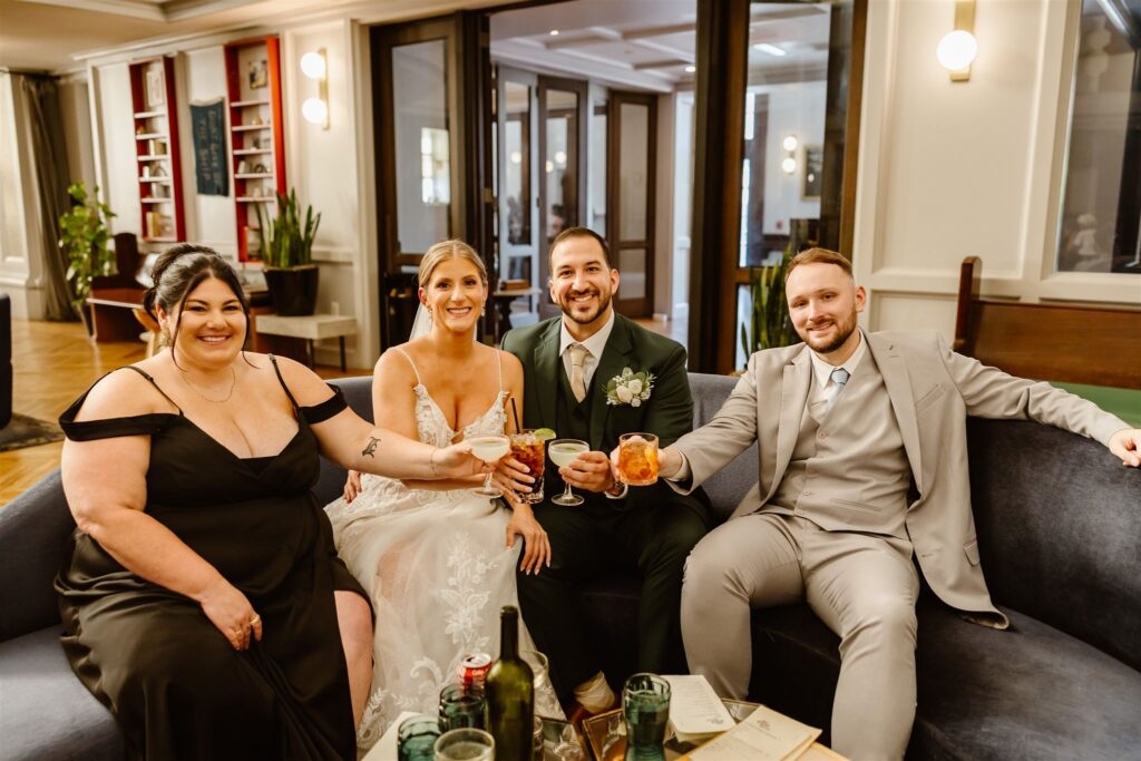 bride and groom celebrating with drinks