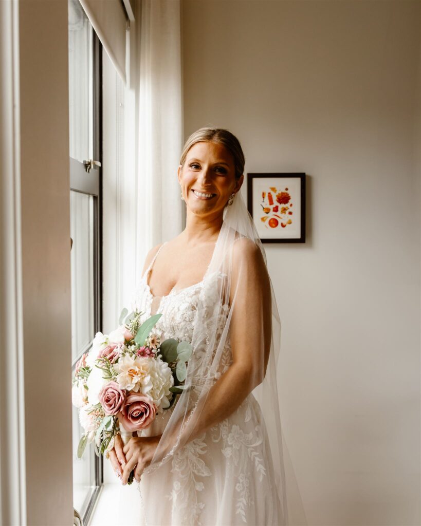 bridal portrait next to the window in a hotel room at line hotel dc