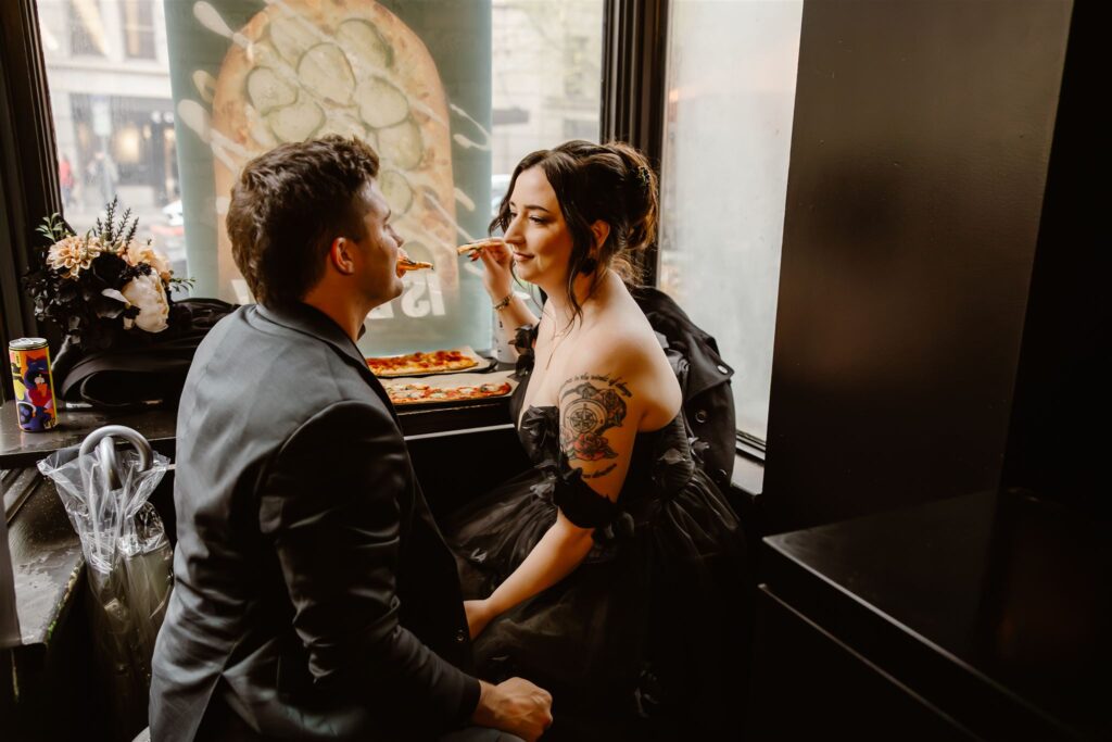 bride and groom enjoying a pizza together during their elopement in washington dc