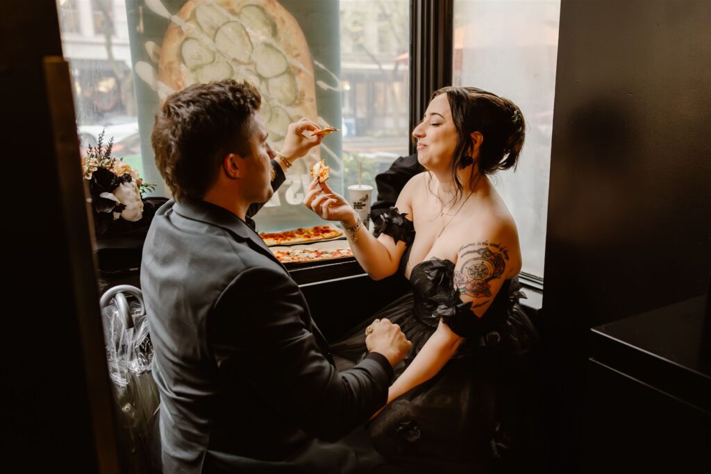 bride and groom enjoying a pizza together during their elopement in washington dc
