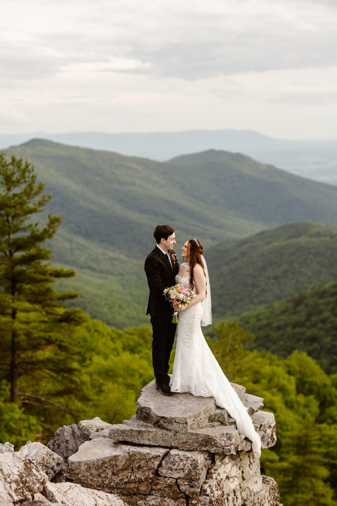 elopement couple hugging at a mountain overlook during their shenandoah summer elopement
