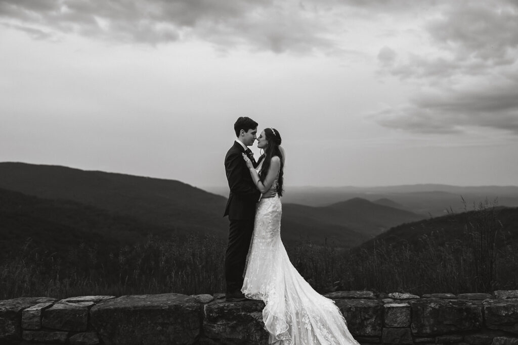 elopement couple hugging at a mountain overlook during their shenandoah summer elopement